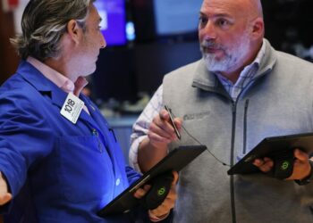Stocks hit records on shrinking service economy and rising jobless claims