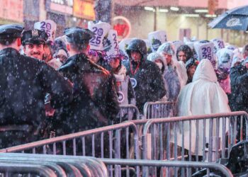 Rain or Shine: New Year’s Eve Partygoers Brave the Storm in Times Square for an Epic Ball Drop!